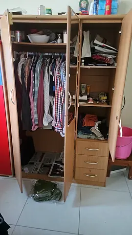 Price is negotiable. Three-door wooden wardrobe with drawers - good condition