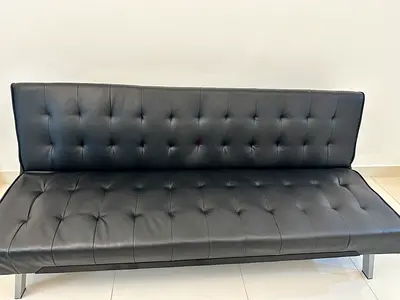 Sofa Bed. Black faux leather convertible sofa bed - modern tufted design