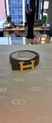 Genuine leather belt with gold 'H' buckle - size likely M/L