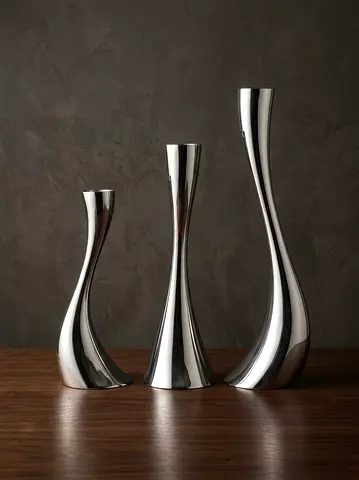 A stunning set of 3 Georg Jensen Cobra Candleholders