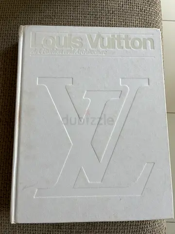Louis Vuitton hardcover coffee table book — embossed logo, white cover