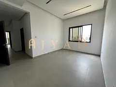 2BR annual rental in Al Alia, Ajman. 2 master bedrooms, 3 bathrooms, central AC, balcony, built-in w
