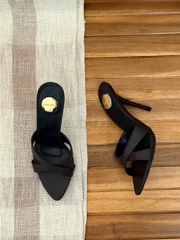 Women's black leather high-heel mules, size unknown - gently used
