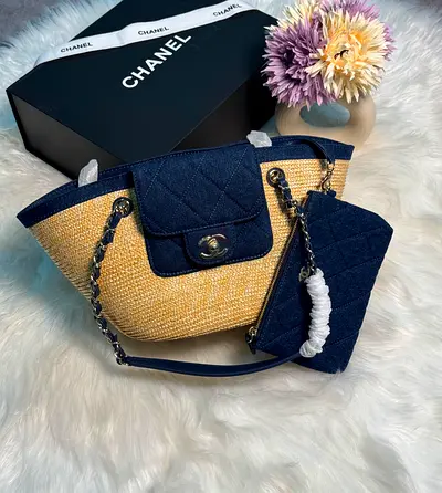Chanel straw tote with navy quilted trim and matching pouch