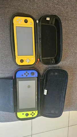 Two Nintendo Switch consoles (Yellow switch lite + Blue/yellow Switch one) with carrying cases