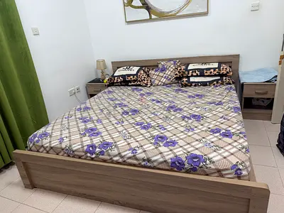 Double wooden bed with two bedside tables - good condition