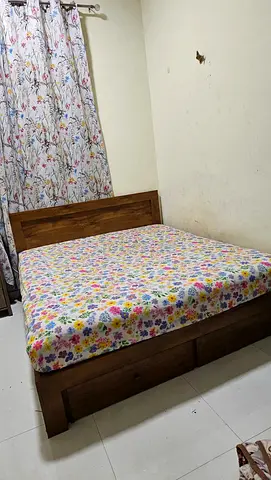Solid wooden double bed with under-bed drawers - good condition