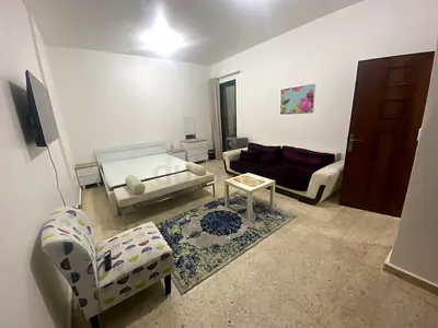 Immidiately Available  master bedroom for single lady or man or couple near cornich khalidia