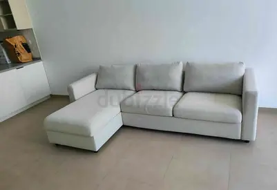 Light grey L-shaped 3-seater sofa with chaise - good condition