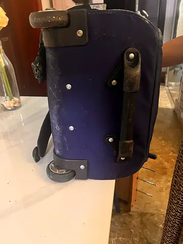 Blue wheeled backpack / carry-on with retractable handle