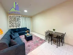 Cleanly furnished 2-bedroom apartment in Al Nuaimiya, Ajman, with central AC, 2 bathrooms and a balc