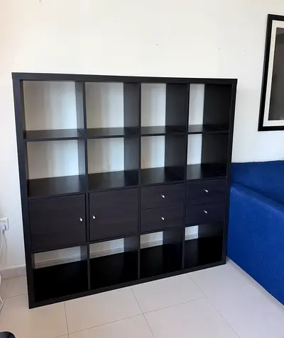 IKEA KALLAX 8-cube shelf room divider (black-brown) with attached sofa back