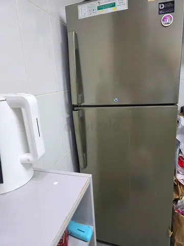 Used double-door refrigerator - stainless steel finish