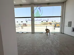 Shop for Annual Rent in Al Sajaa with an area of 1,000 square feet featuring a glass frontage fully 