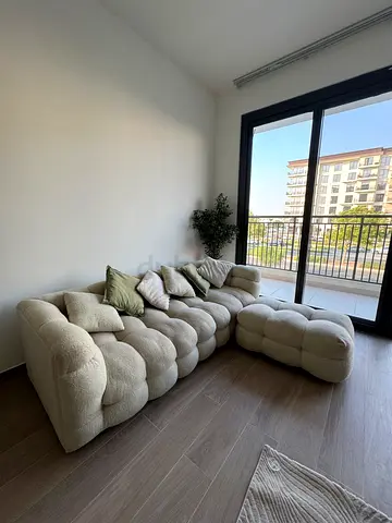 Cream Bouclé L-Shaped Sofa with Ottoman | Deep Cleaning Recommended | AED 1,500