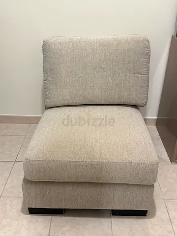 Light grey single armless sofa chair - good condition