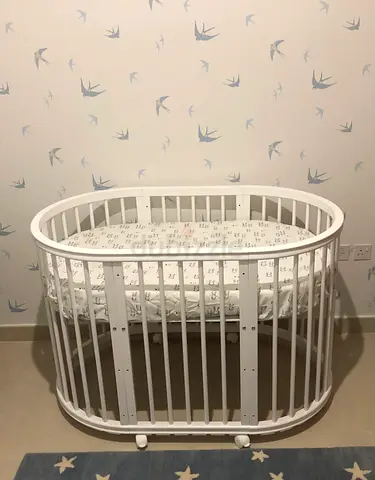 Crib oval white color mattress included