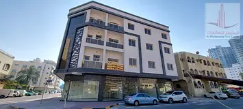 Shop for annual rent in Rashidiya 2, excellent location on a main street, large area