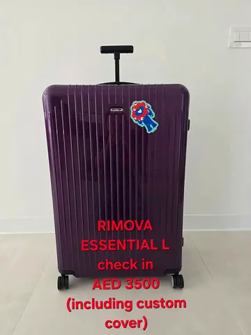 RIMOWA Essential Check-In L hard shell suitcase - magenta (used)