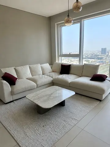 White L-shaped Fabric Sofa with Cushions — Good Condition