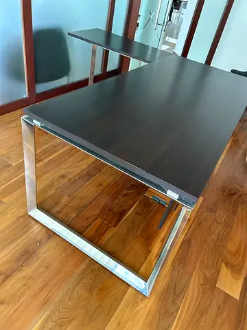 Modern dark wood office desk with chrome base