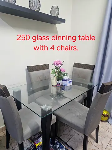 Glass dinning table with 4 chairs.