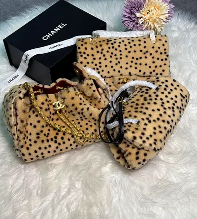 Chanel spotted faux-fur handbag and matching pouch set - excellent condition