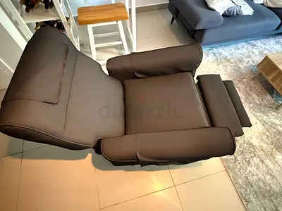 Dark grey recliner armchair with footrest - barely used