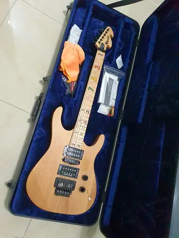 Used natural finish electric guitar with hard case and accessories