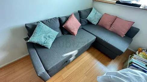 Gray L-shaped Sofa Bed with Storage - Good Condition