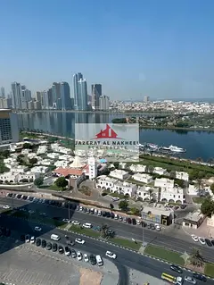 For sale: A distinctive two-bedroom apartment with a living room in Al Majaz 1, with an open view of
