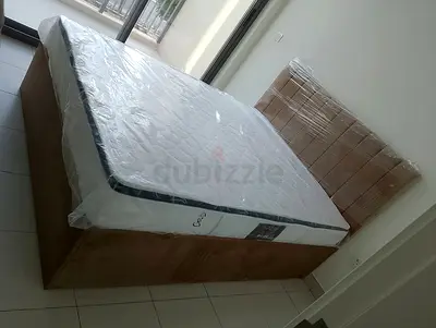 Queen size bed base with new mattress (still wrapped)