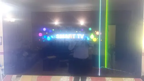 Large Smart TV with cracked screen and vertical color lines (for parts/repair) damaged 70-inch JVC