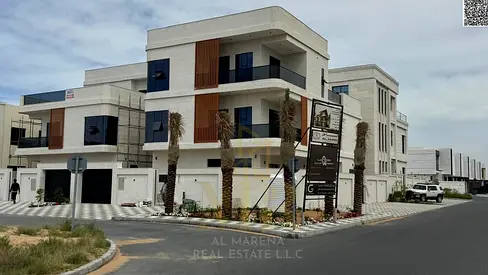Luxury villa for sale in Al Alia, Ajman | Corner villa on two streets, two floors and a roof terrace, 7 master bedrooms | Price includes electricity,