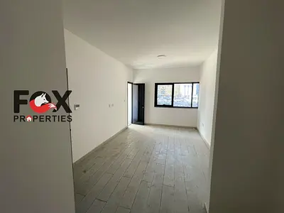 Two-bedroom apartment with a living room, first occupancy, for annual rent in Ajman – balcony and 2 bathrooms