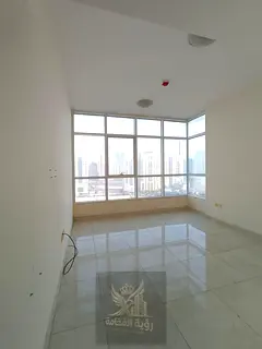 For annual rent in Al Taawun two bedroom apartment with living room balcony and open view with free