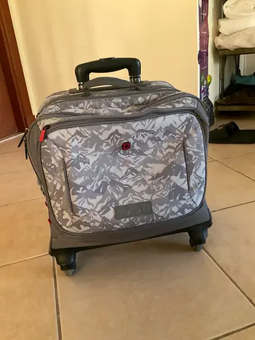 Small wheeled backpack/rolling carry-on with camouflage pattern