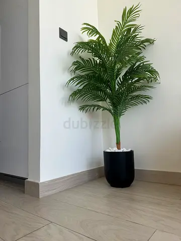 Artificial tall palm plant in black pot - good condition