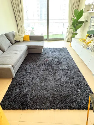 Large black shaggy area rug - excellent condition