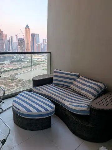 Outdoor Wicker Daybed with Ottoman and Striped Cushions