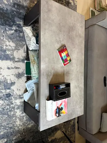 Rectangular concrete-look coffee table with lower shelf