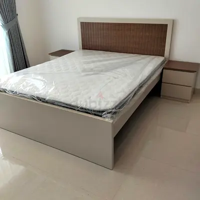 King bed frame with headboard and two bedside tables -