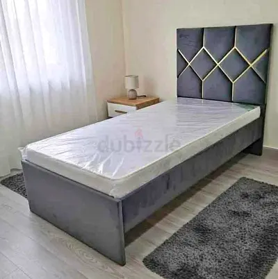 Single grey upholstered bed with headboard - like new