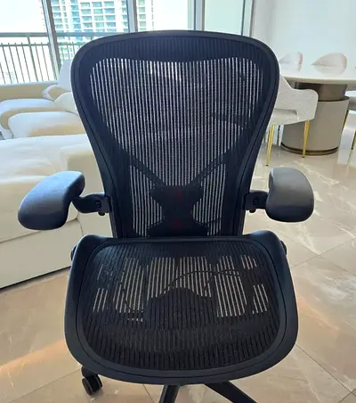 Used ergonomic mesh office chair - adjustable armrests and lumbar support