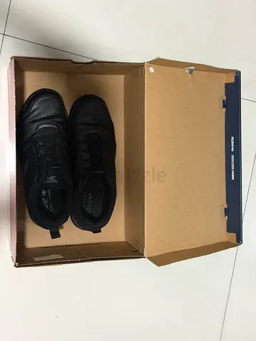 Black leather trainers, lightly used — size not specified
