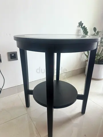 Round black side table with lower shelf - good condition