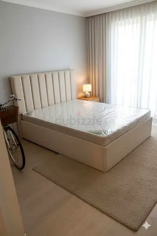 Beige upholstered queen bed with storage - good quality