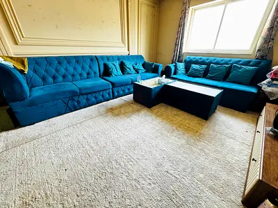 Large blue velvet L-shaped sofa set with cushions - good condition