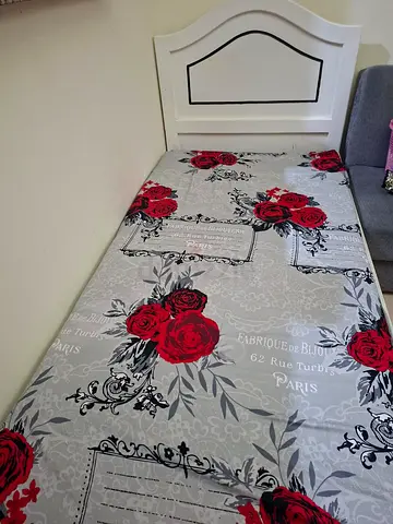 Single bed with headboard and floral mattress - good condition