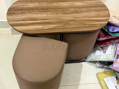 Compact entryway/storage bench with cushioned stool and wood top